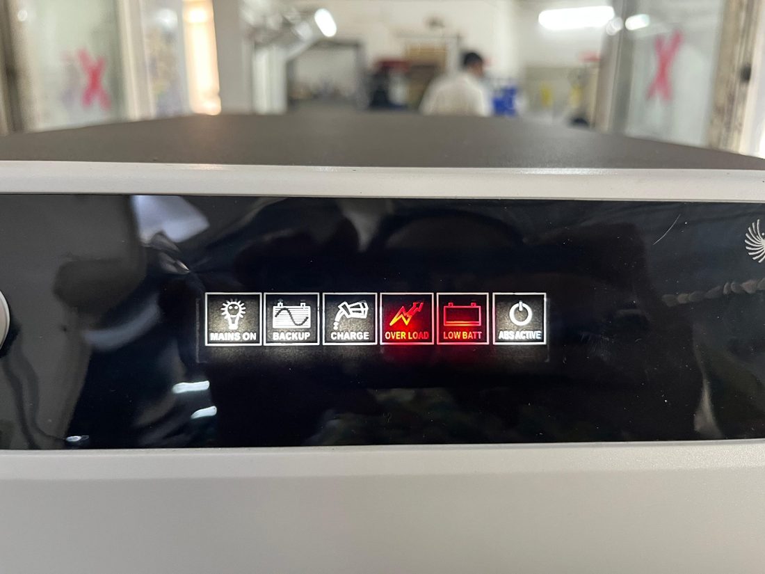 Su-vastika UPS LED panel showing overload warning light — mains on, backup, charge, overload, low battery, ABS active indicators